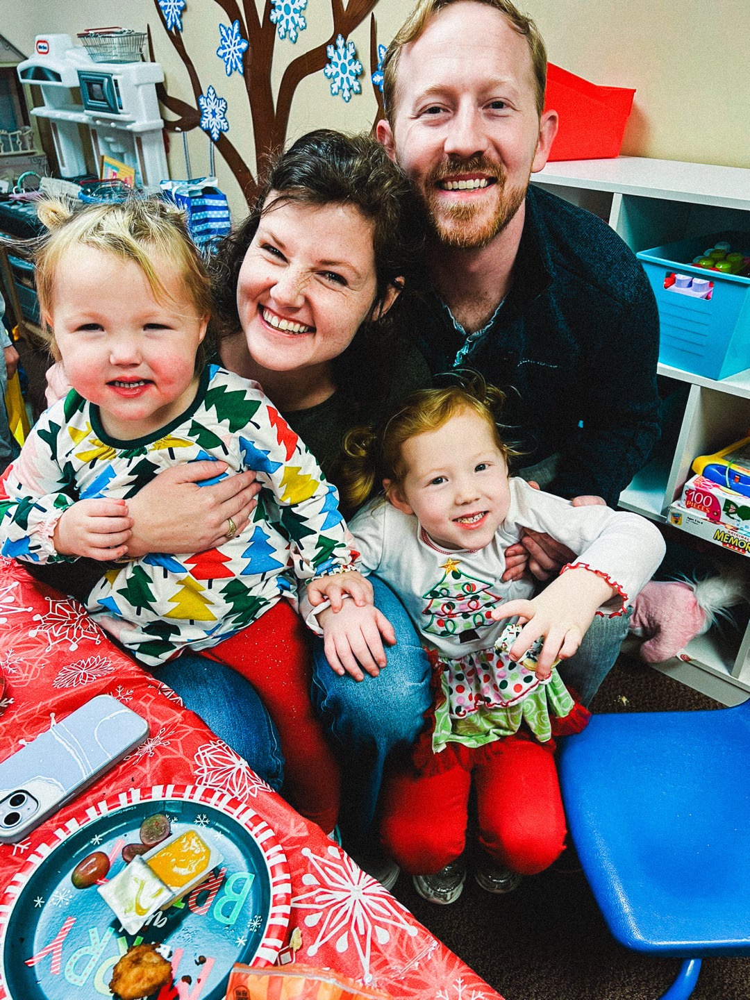 photo of Josh, Jen, Ellie, and Emmie at the Shades Crest Preschool Christmas party